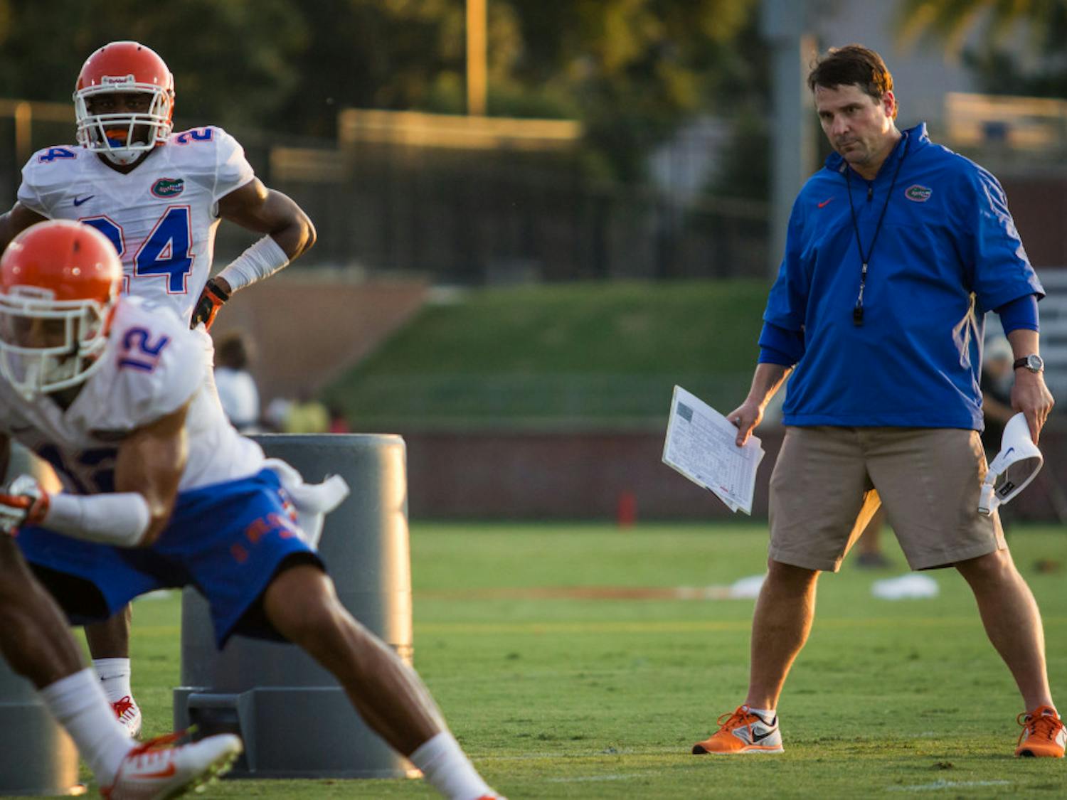 Will Muschamp looks on during practice on Aug. 9 at Donald R. Dizney Stadium. Muschamp, entering his fourth year as head coach, faces a tough schedule including road games against Alabama and Florida State.