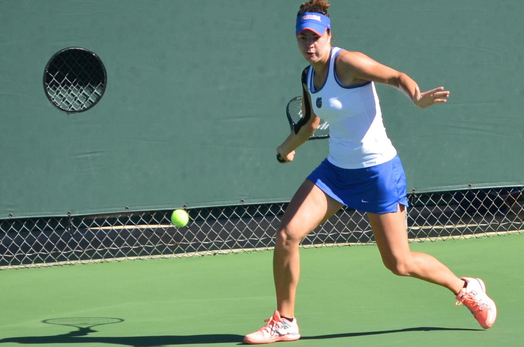 Freshman Stefani Stojic swings at the ball during her  first round singles match against USF freshman Olaya Garrido-Riyas on Oct. 10 during the Bedford Cup at the Ring Tennis Complex.