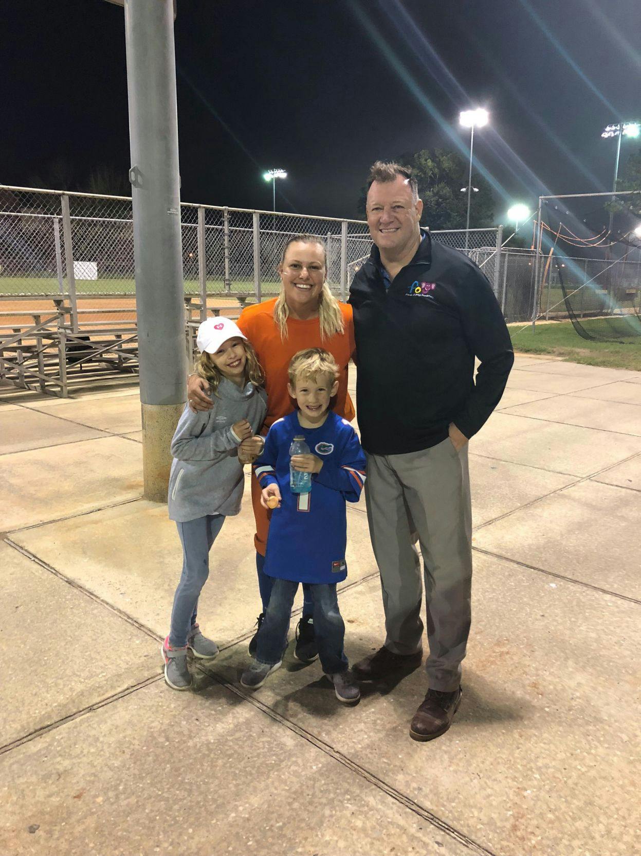 Hartley poses for the camera with her 7-year-old brother, Carter, Denis Murphy, founder of the Friends of Jaclyn Foundation, and UF first baseman/left fielder Amanda Lorenz.&nbsp;