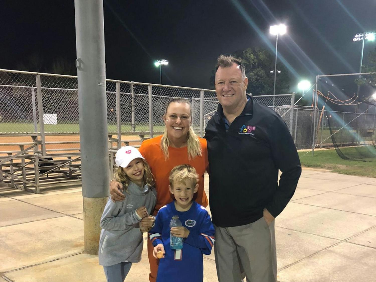Hartley poses for the camera with her 7-year-old brother, Carter, Denis Murphy, founder of the Friends of Jaclyn Foundation, and UF first baseman/left fielder Amanda Lorenz.&nbsp;