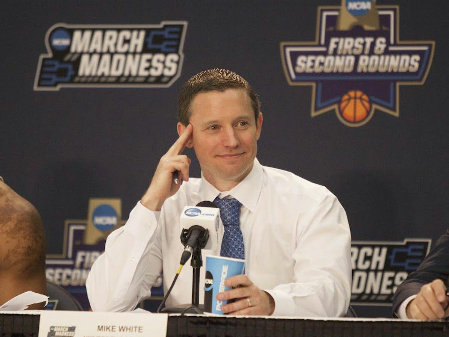 UF head coach Mike White smiles during a press conference following Florida's 65-39 win against Virginia in the NCAA Tournament on March 18, 2017, in Orlando.