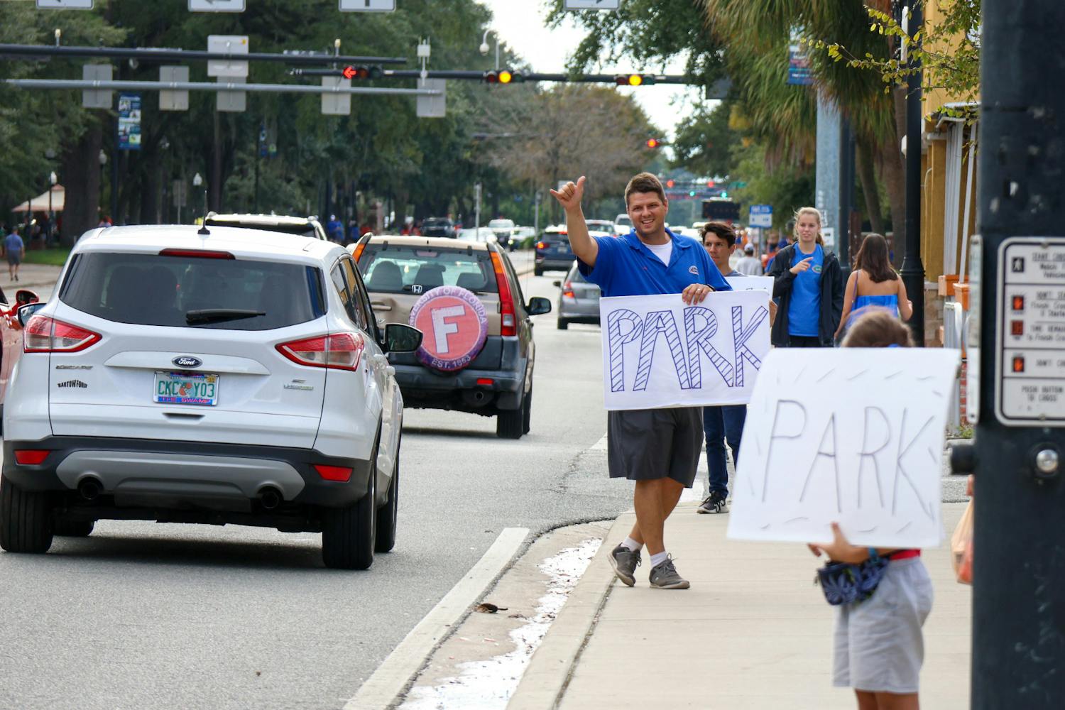 A gator fan advertises parking off of West University Avenue prior to Florida’s game against USF Saturday, Sept 17, 2022.