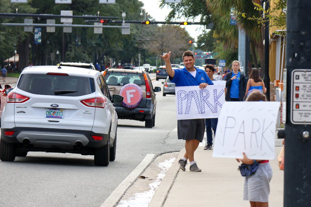 <p>A gator fan advertises parking off of West University Avenue prior to Florida’s game against USF Saturday, Sept 17, 2022.</p><p><br/><br/></p>
