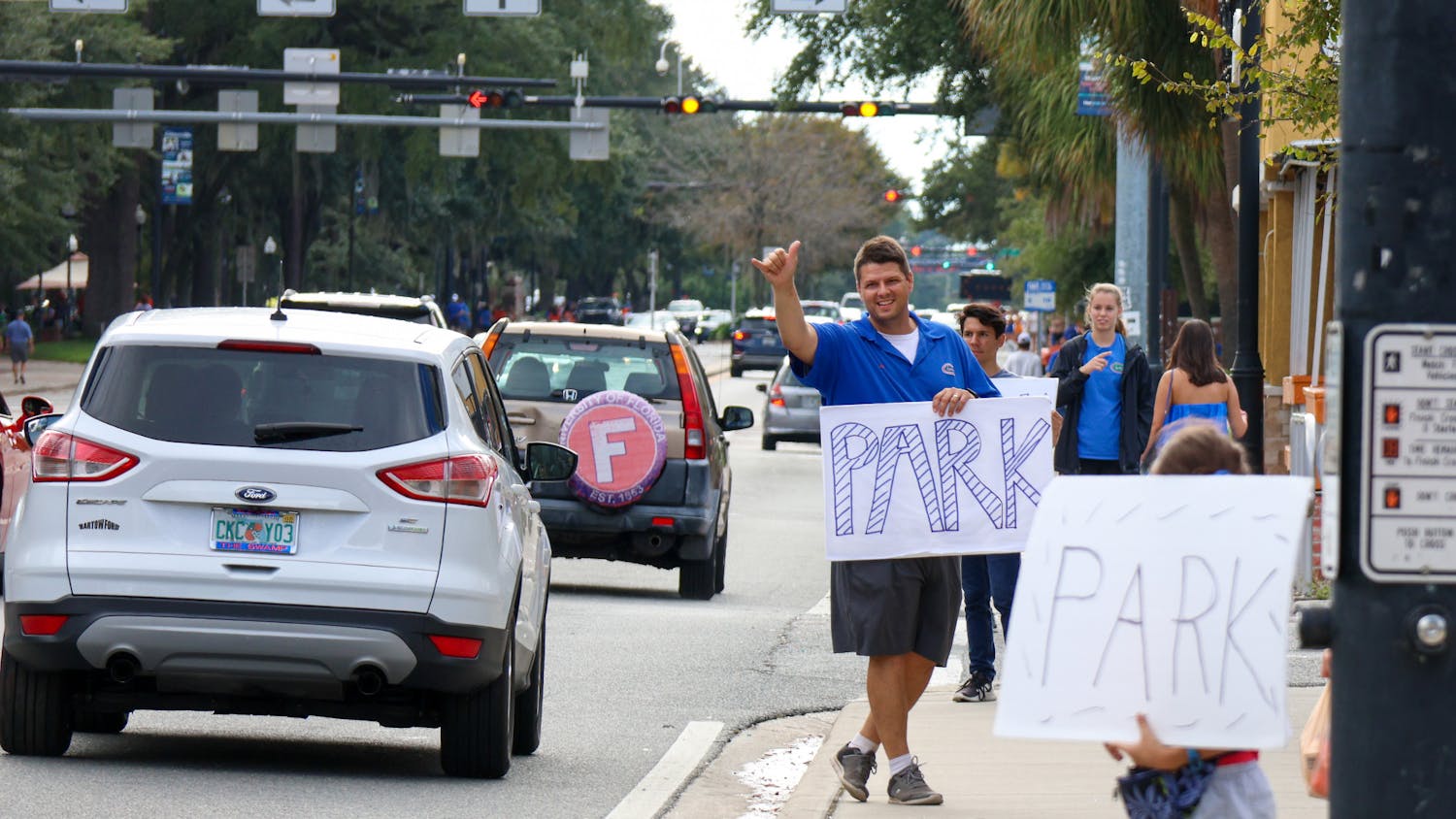 A gator fan advertises parking off of West University Avenue prior to Florida’s game against USF Saturday, Sept 17, 2022.