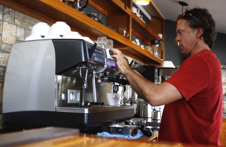 Danny Thomas, 45, brews fresh coffee for customers Tuesday. Although the staff of CYM Coffee Co. doesn’t like titles, Thomas is a manager and enjoys his work, where a cup of coffee is always at his fingertips.