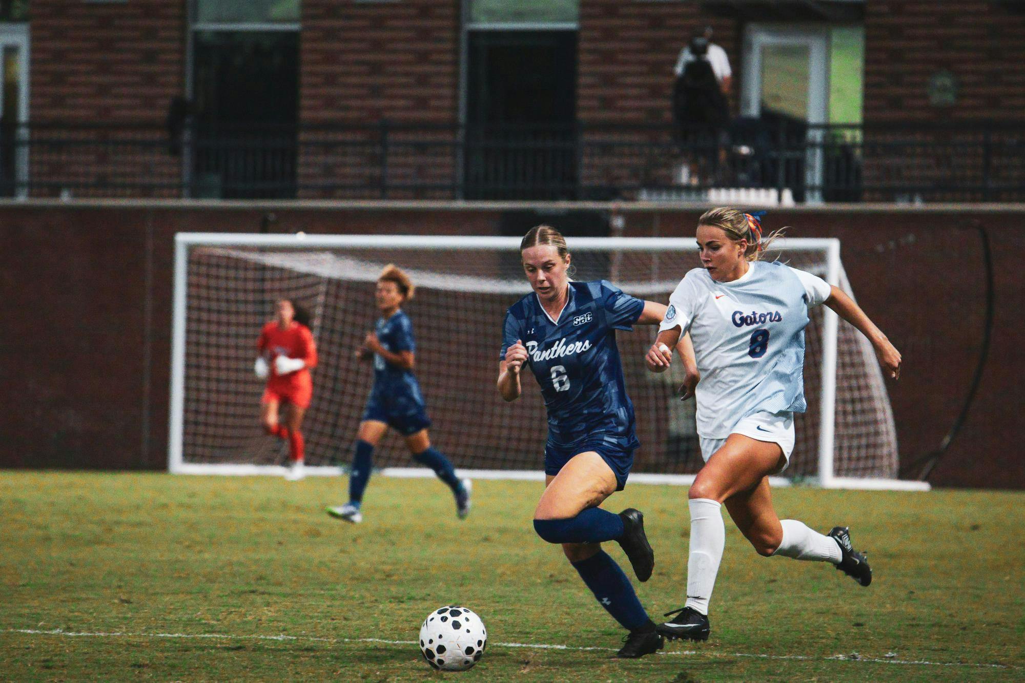 Florida soccer redshirt senior Charlotte McClurre (8) attempts to gain posession of the ball.