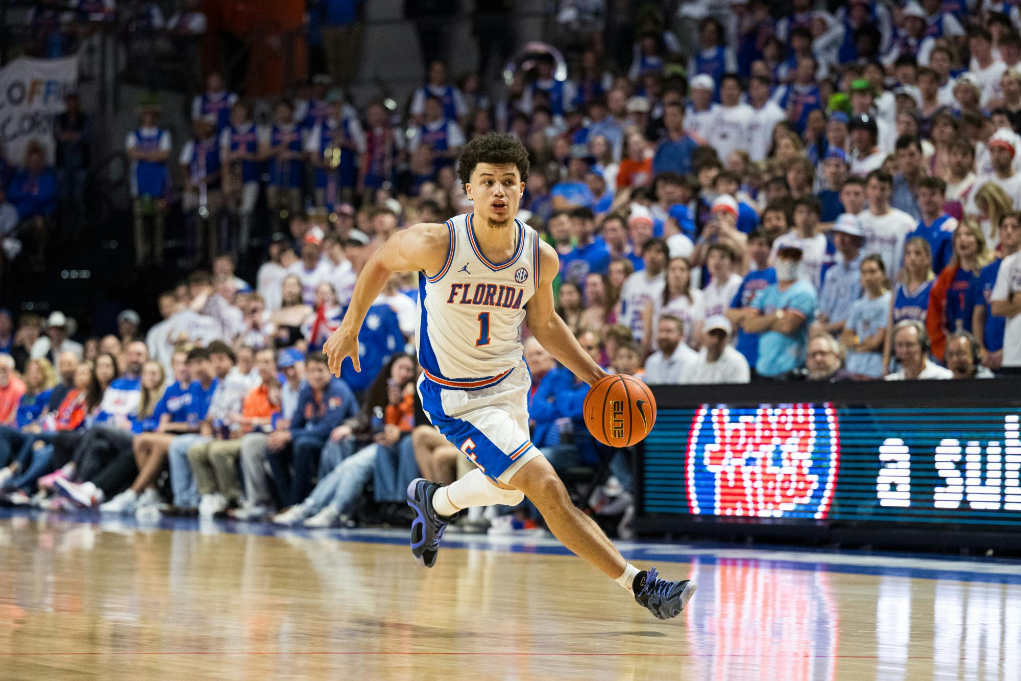 Florida Gators guard Walter Clayton Jr. (1) dribbles the ball in a basketball game against Texas A&M on Saturday, Mar. 1, 2025, in Gainesville, Fla.