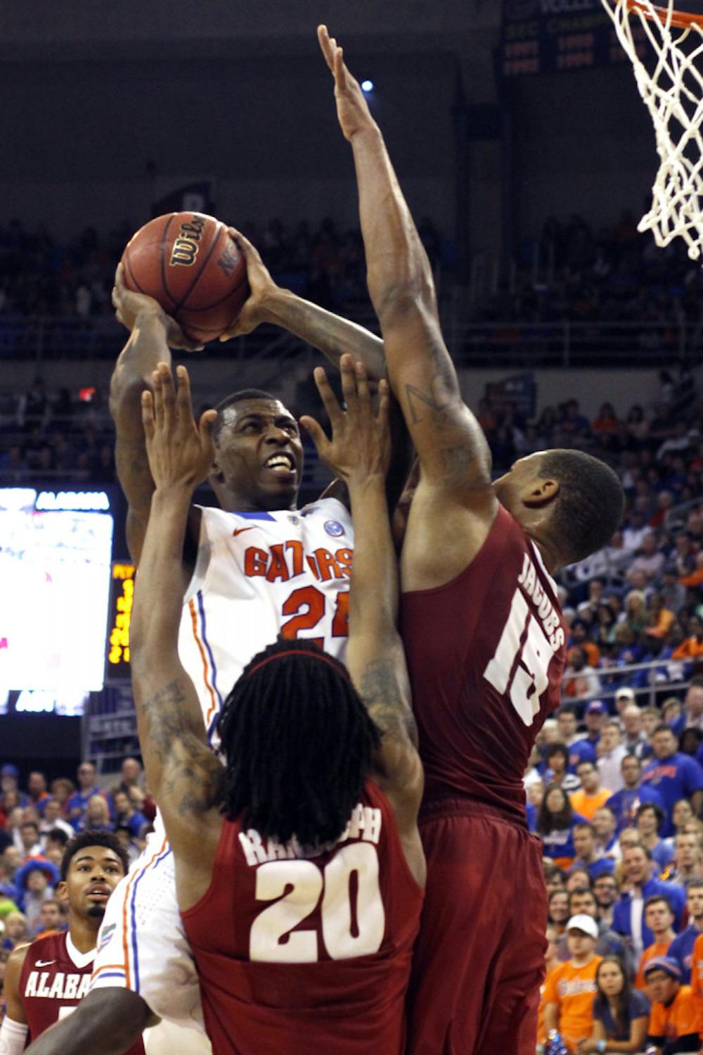 <p>Casey Prather (24) attempts a shot while being contested by two Alabama defenders during Florida's 64-52 victory in the O'Connell Center. Prather had 10 points and nine rebounds in the win. </p>