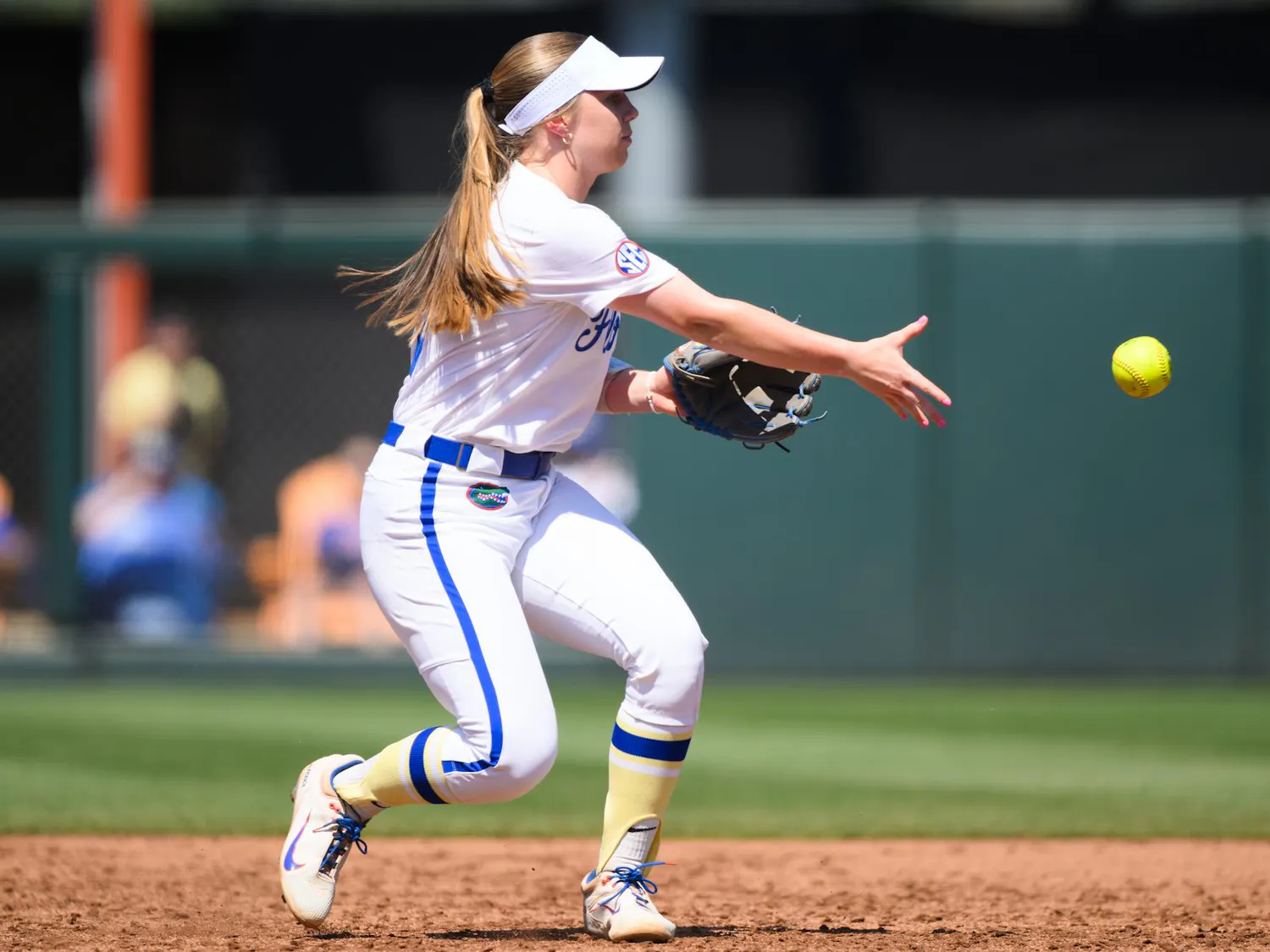 Florida infielder Kenleigh Cahalan (31) tosses to second base during an NCAA softball game against Tennessee, Saturday, March 21, 2026, in Gainesville, Fla.