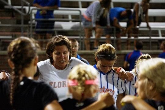 Gators coach Becky Burleigh consoles her team in 2015 after a 2-1 loss at the hands of Texas A&amp;M. Burleigh has been at the helm for Florida since 1995.