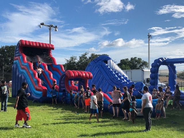 People go down two water slides featured at the event.
&nbsp;
