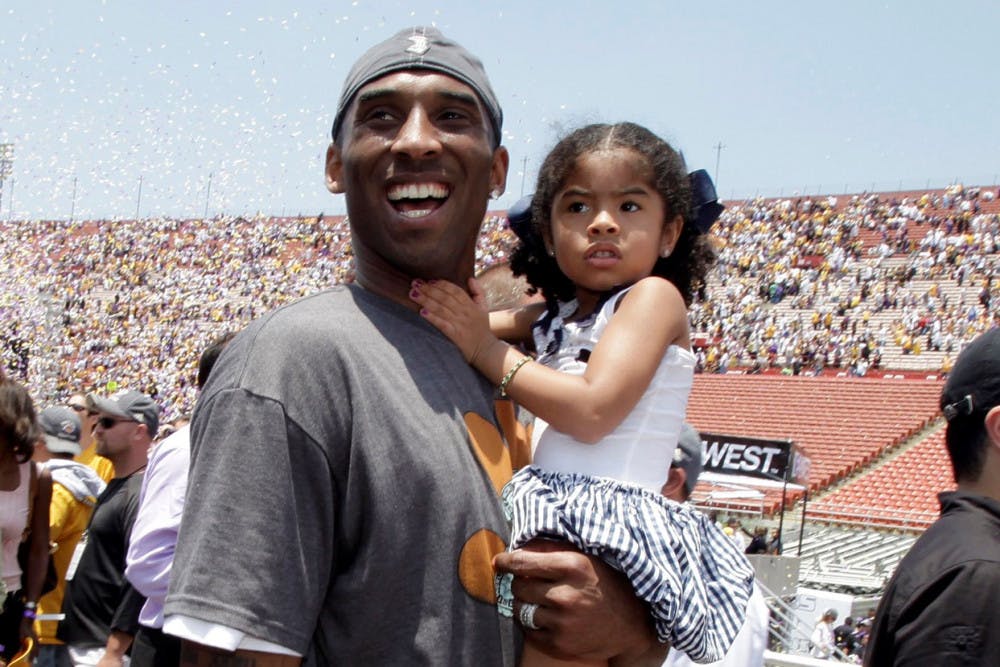 <p>In this June 17, 2009 file photo Los Angeles Lakers' Kobe Bryant smiles as he and his daughter Gianna Maria-Onore walk up the steps after the victory parade celebrating the Lakers' NBA championship in Los Angeles. Bryant, the 18-time NBA All-Star who won five championships and became one of the greatest basketball players of his generation during a 20-year career with the Los Angeles Lakers, died in a helicopter crash Sunday, Jan. 26, 2020. Gianna also died in the crash. (AP Photo/Jae C. Hong, file)</p>
