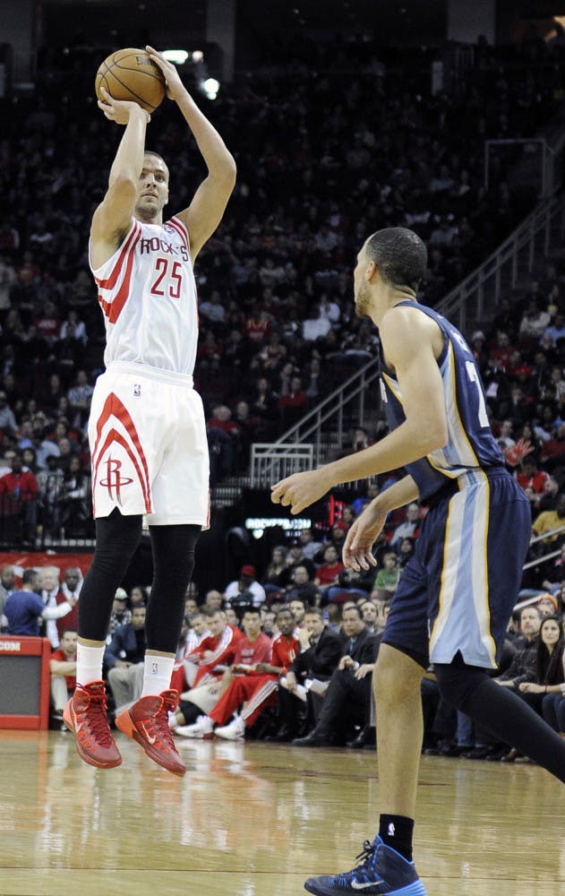 Houston Rockets’ Chandler Parsons (25) shoots a three-point shot as Memphis Grizzlies’ Tayshaun Prince watches on Jan. 24 in Houston.