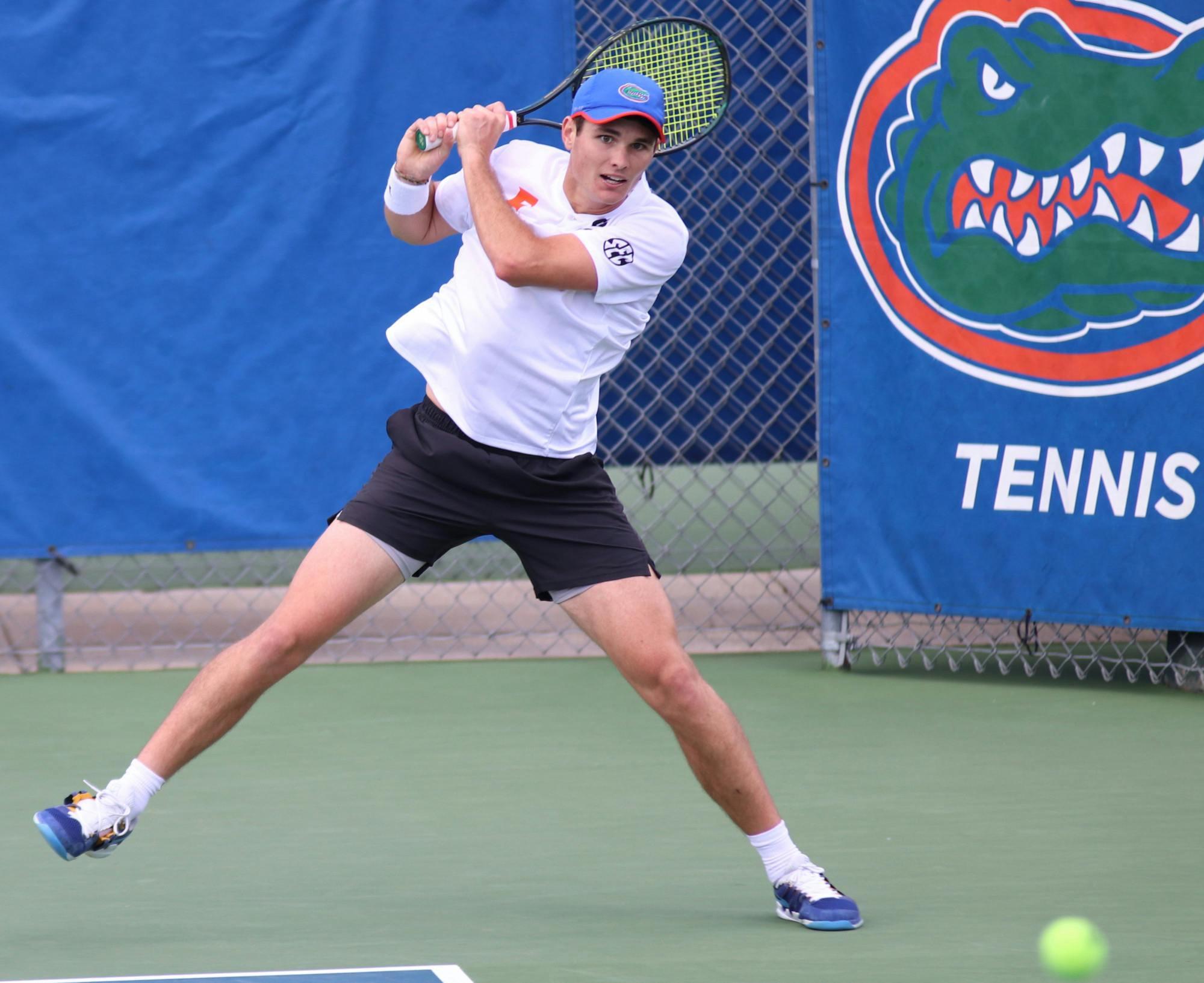 Sam Riffice returns a ball against Auburn on February 21.