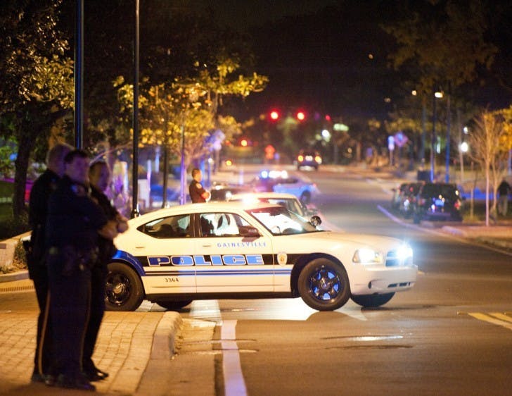 Police line Southwest Eighth Avenue early Friday morning during the search for an armed suspect who robbed a woman at gunpoint near Sorority Row, according to GPD Lt. Jorge Campos.