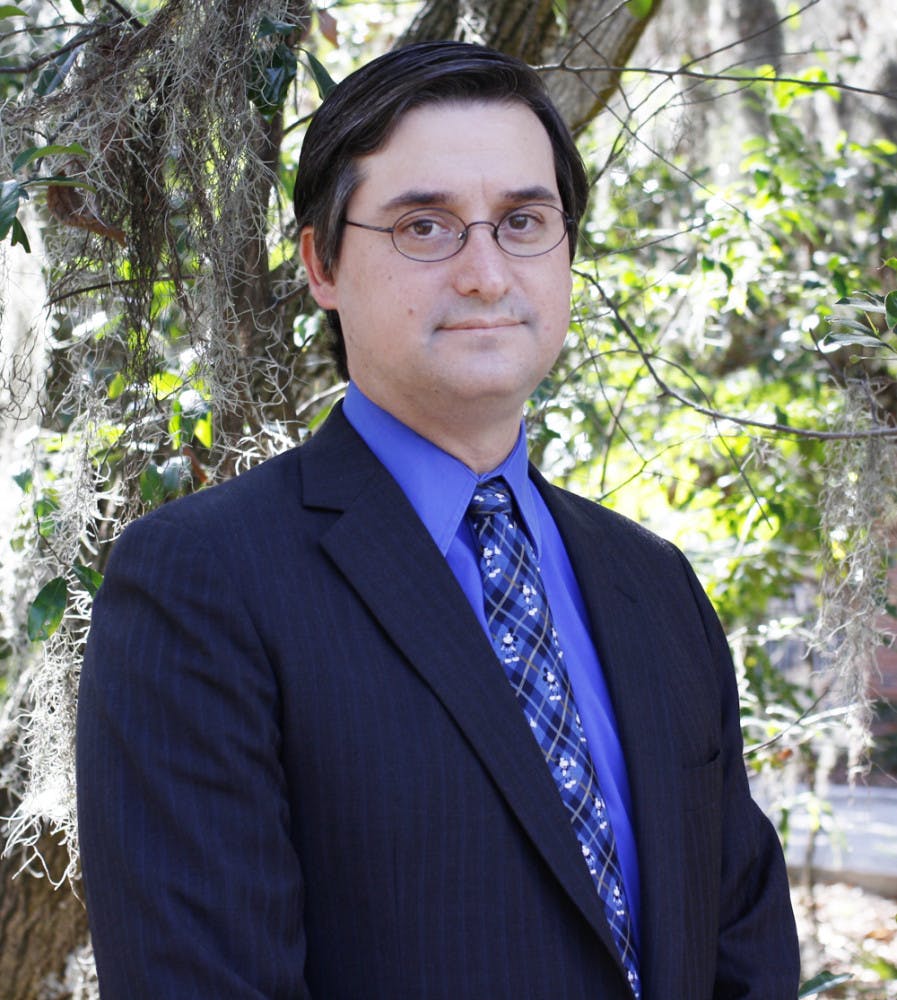 Dr. David A. Weinstein stands outside the Reitz Union on Saturday afternoon. Weinstein is a recent recipient of the Order of the Smile award.