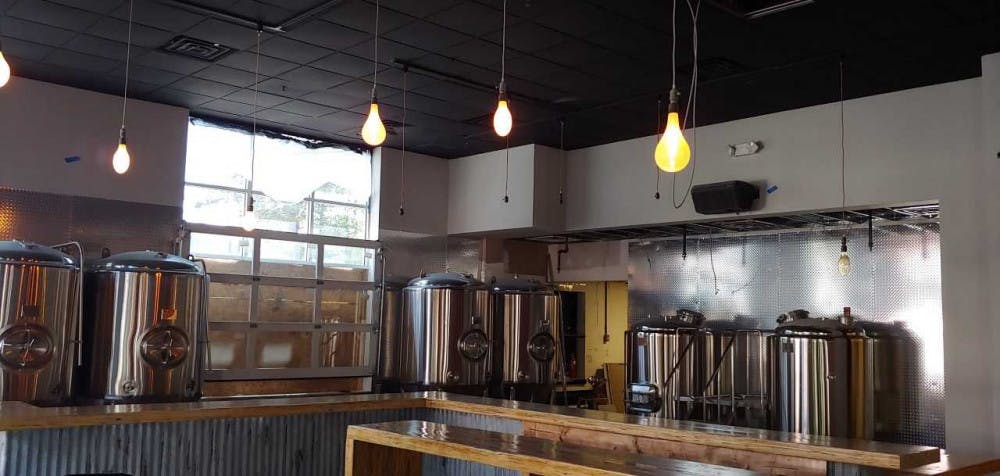 Vintage Edison light bulbs illuminate the inside of Big Top Brewing Co. The new brewery will open next to Mark’s Prime Steakhouse downtown in mid-October. 