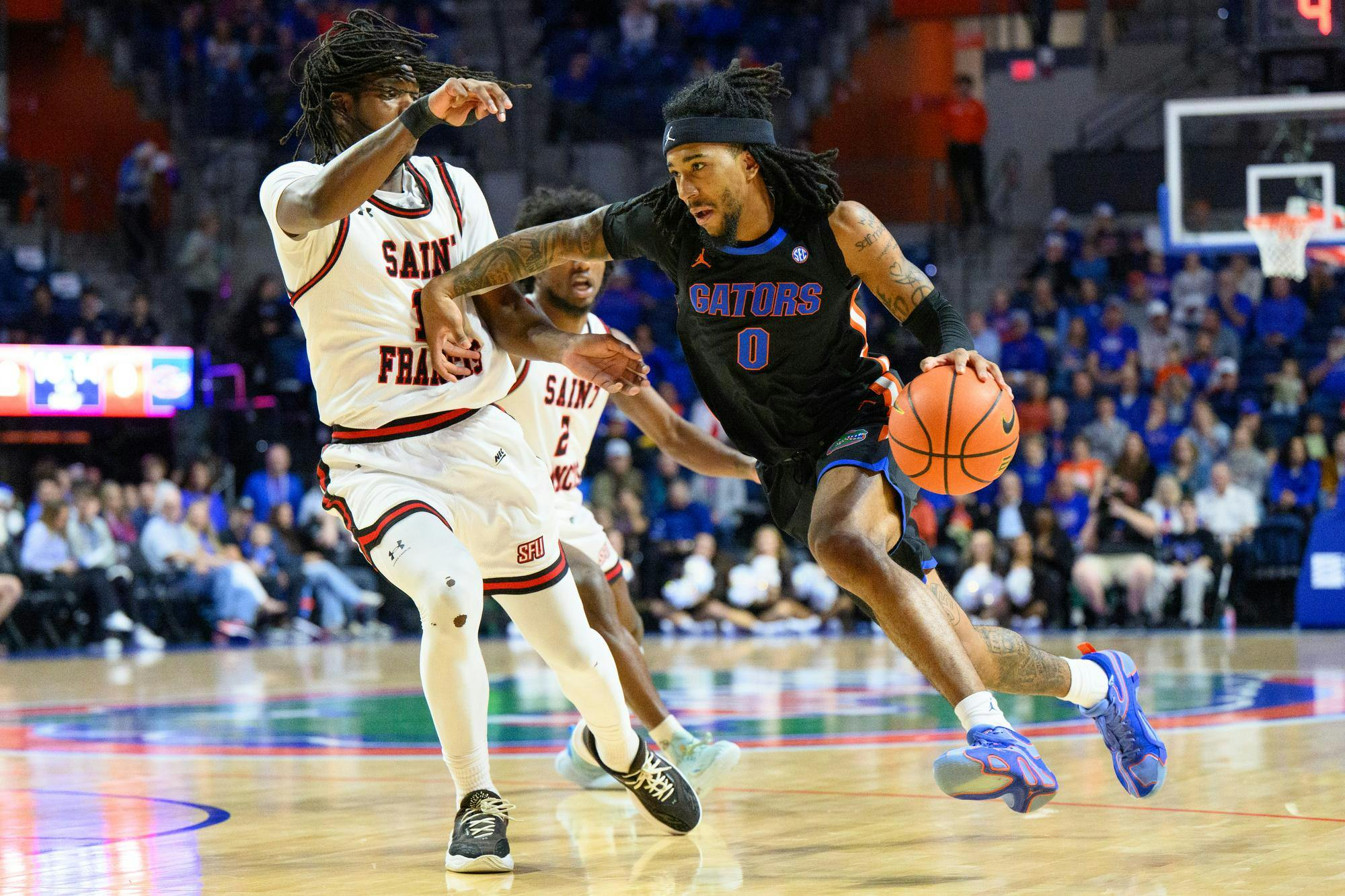 Florida guard Boogie Fland (0) drives during the first half of an NCAA college basketball game against Saint Francis, Wednesday, Dec. 17, 2025, in Gainesville, Fla.