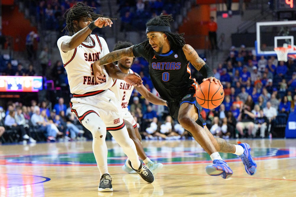 Florida guard Boogie Fland (0) drives during the first half of an NCAA college basketball game against Saint Francis, Wednesday, Dec. 17, 2025, in Gainesville, Fla.