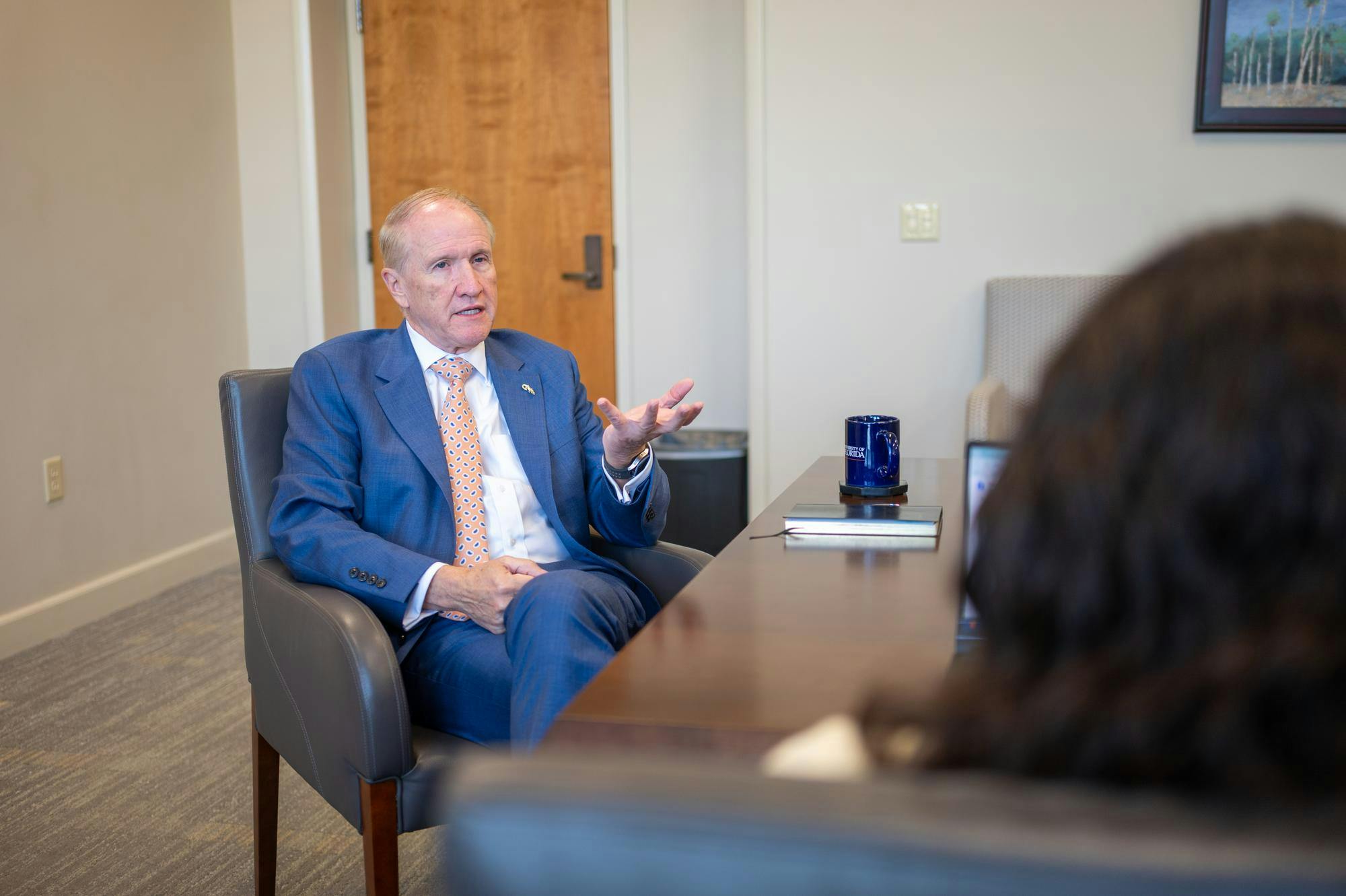 UF President Dr. Stuart Bell speaks with university reporter Swasthi Maharaj during an interview in the Presidential Conference Room at Tigert Hall, Thursday, Aug. 14, 2026, in Gainesville, Fla.
