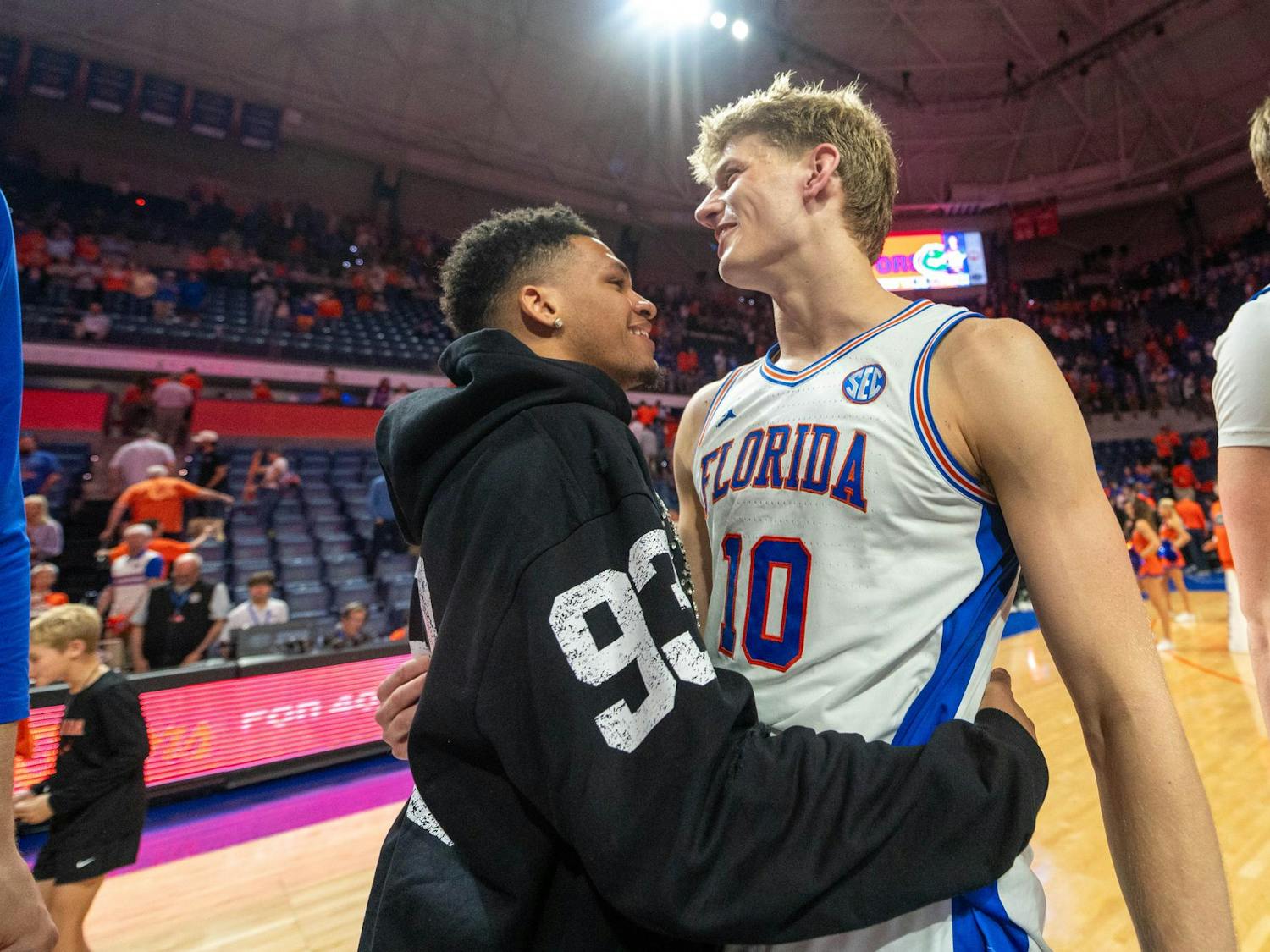Florida forward Thomas Haugh (10) hugs his former teammate Will Richard after winning an NCAA college basketball game against Kentucky, Saturday, Feb. 14, 2026 at Exactech Arena in Gainesville, Fla.