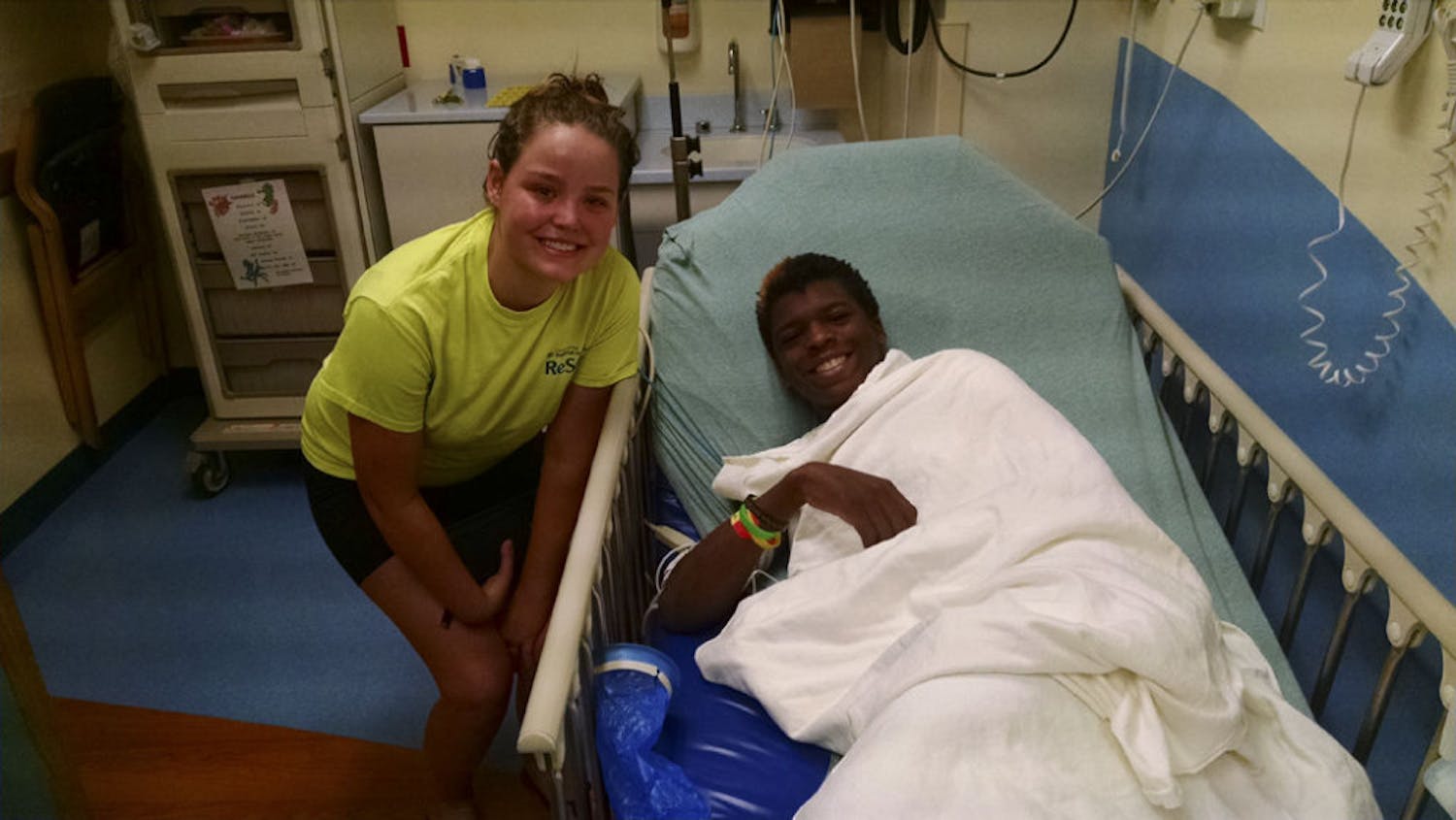 Emma Campbell, left, poses for a photo with 16-year-old Zyvion Speed-Mitchell at UF Health Shands Hospital