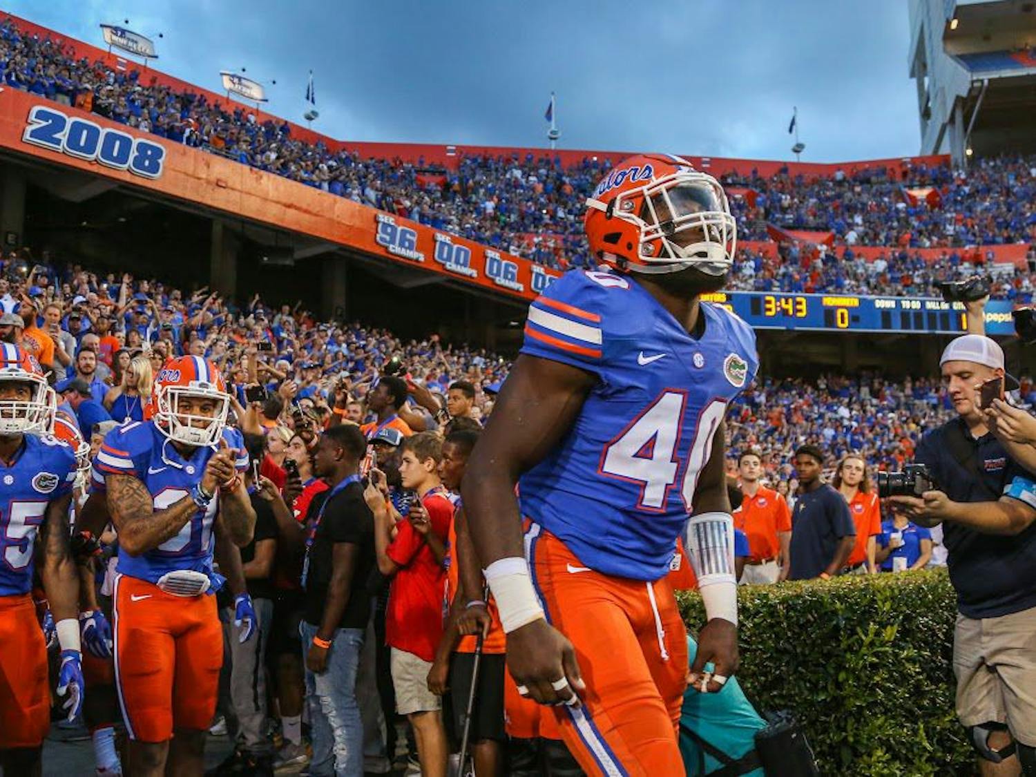 Senior linebacker Jarrad Davis leads his team out of the tunnel before Florida's 32-0 win against North Texas on Sept. 17, 2016, at Ben Hill Griffin Stadium in Gainesville. 