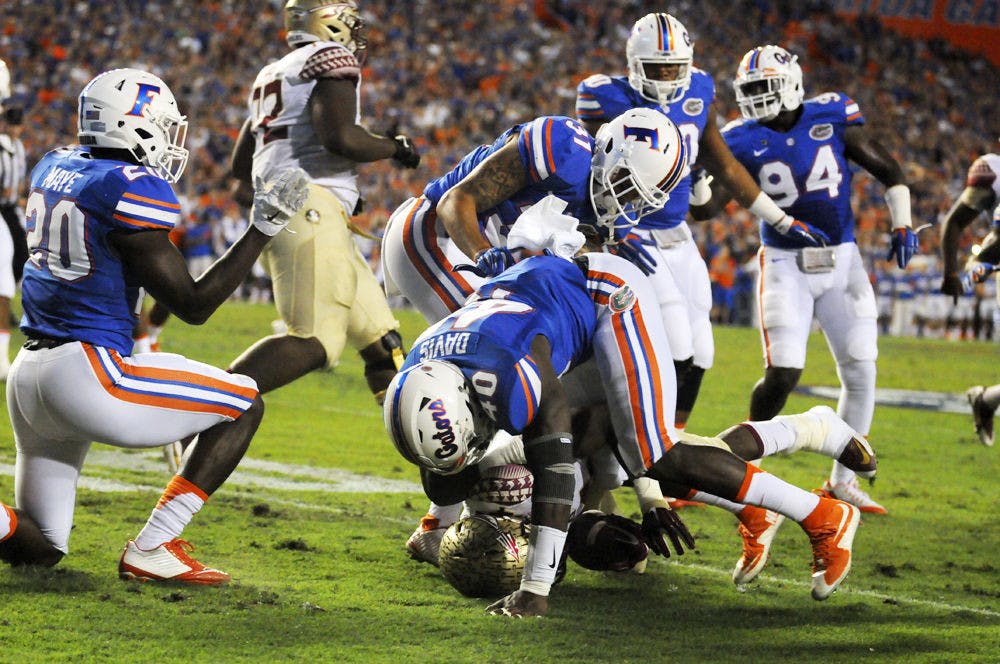 UF linebacker Jarrad Davis tackles Florida State running back Dalvin Cook during Florida's 27-2 loss on Nov. 28, 2015, at Ben Hill Griffin Stadium.