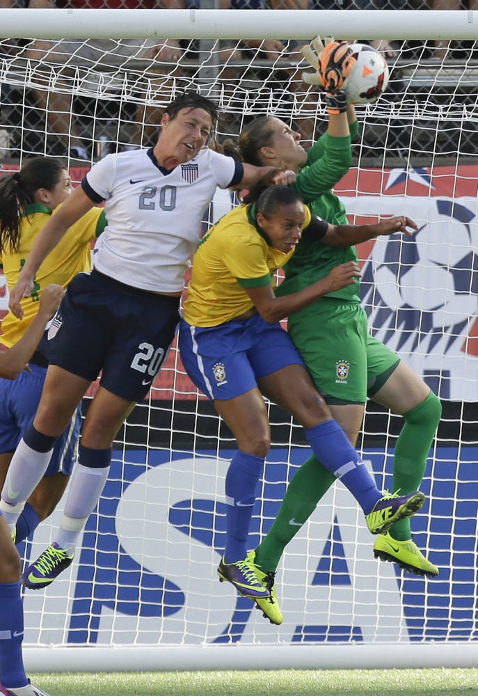 U.S. forward Abby Wambach (20) tries to head the ball in the goal during the first half of an international friendly soccer match against Brazil in Orlando on Sunday.