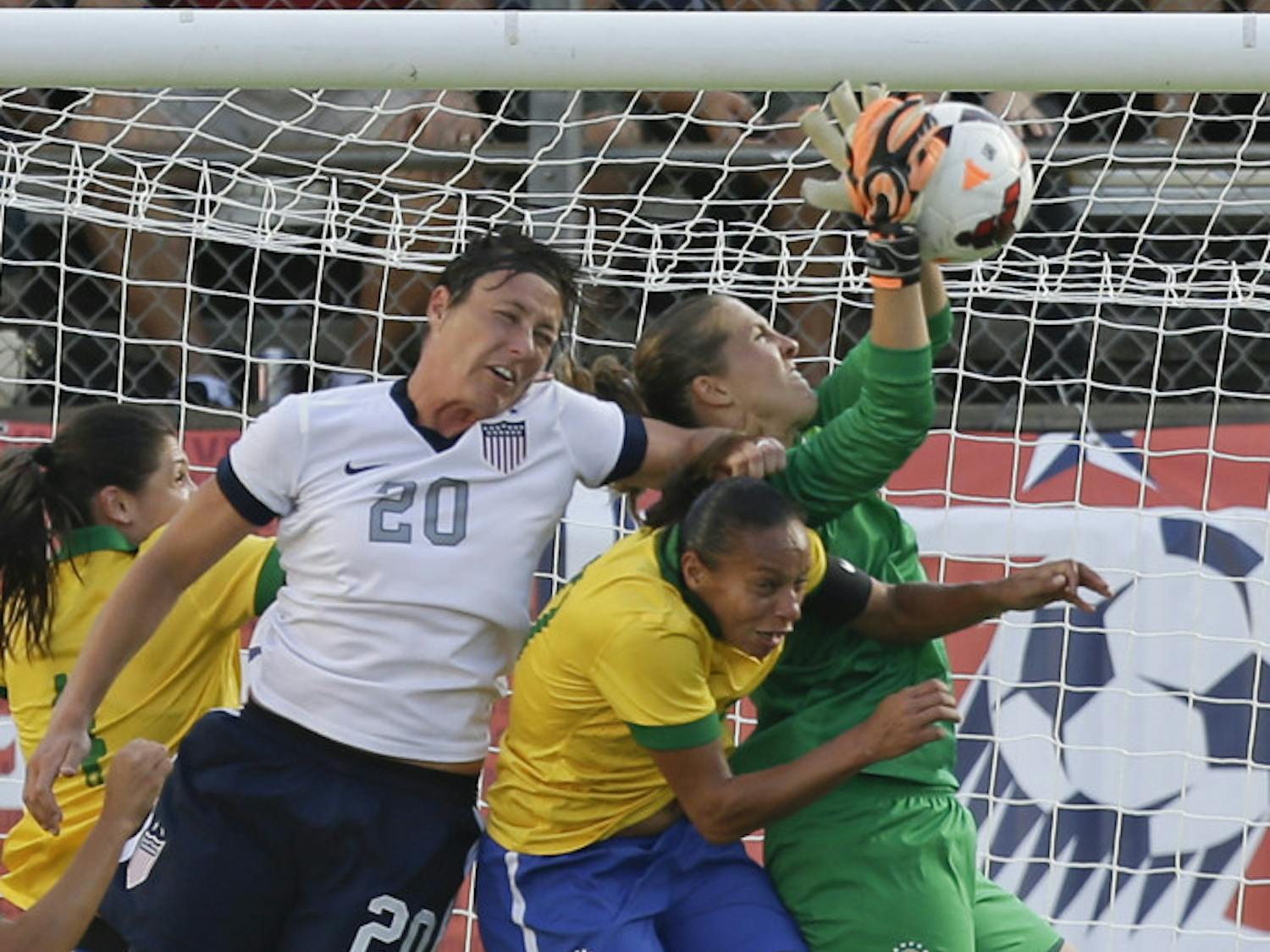 U.S. forward Abby Wambach (20) tries to head the ball in the goal during the first half of an international friendly soccer match against Brazil in Orlando on Sunday.