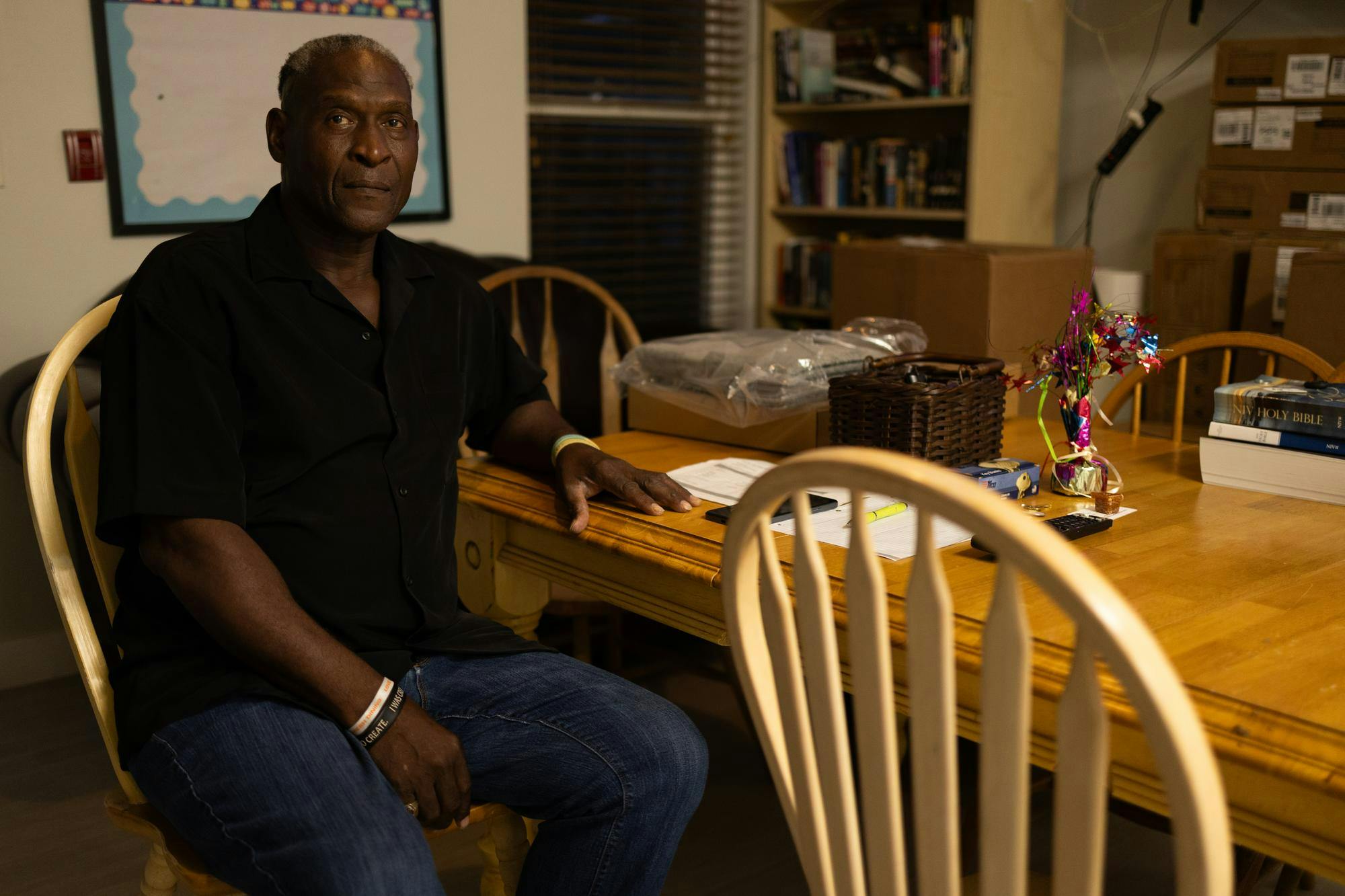 Milton Ray Beverly, Resident Manager of the VA buildings at the Gainesville Continuum of Care, poses at a table, Friday, Oct. 9, 2026, in Gainesville, Fla.