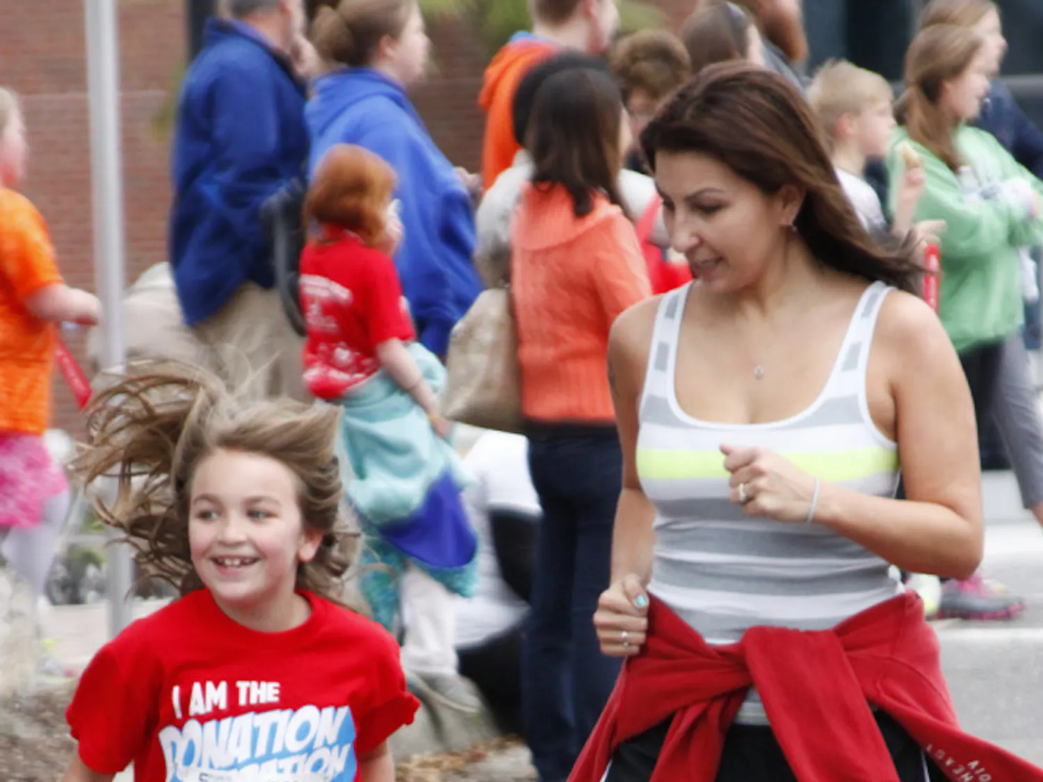 Brenna Fox, 8, runs with her mother Yael Fox, 32, in the Five Points of Life Kids Marathon. This was their second year participating.
