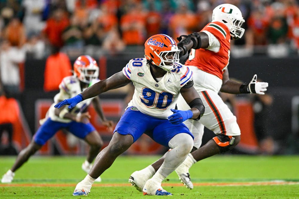 Florida Gators defensive lineman Brendan Bett (90) changes direction during a football game between the Miami Hurricanes and the Florida Gators on Sept. 20, 2025, at Hard Rock Stadium in Miami Gardens, Fla.