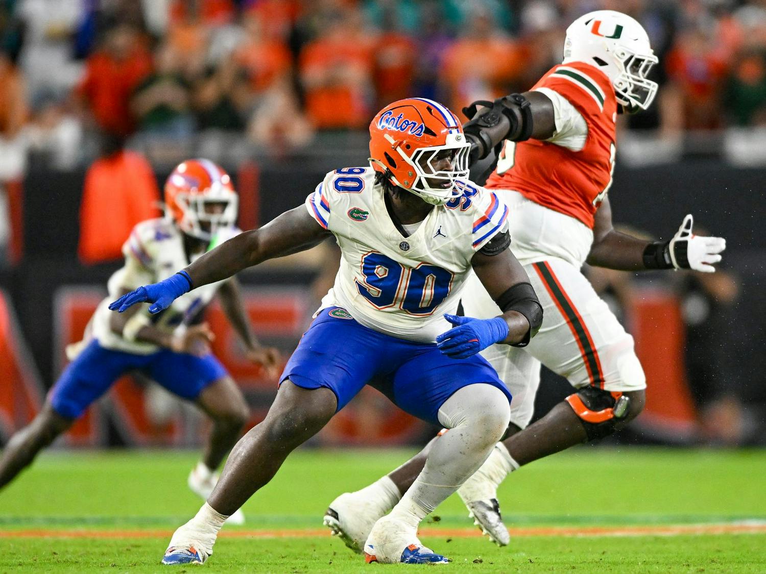 Florida Gators defensive lineman Brendan Bett (90) changes direction during a football game between the Miami Hurricanes and the Florida Gators on Sept. 20, 2025, at Hard Rock Stadium in Miami Gardens, Fla.