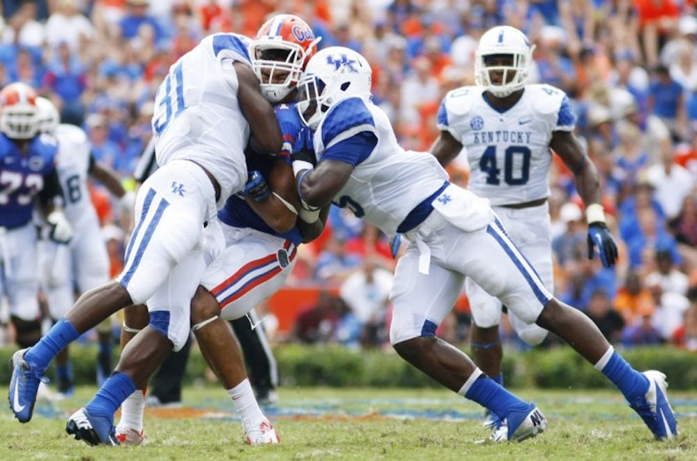 <p>Red shirt junior tight end Jordan Reed takes a hard hit during Florida's 38-0 victory against Kentucky at Ben Hill Griffin Stadium on Saturday.</p>