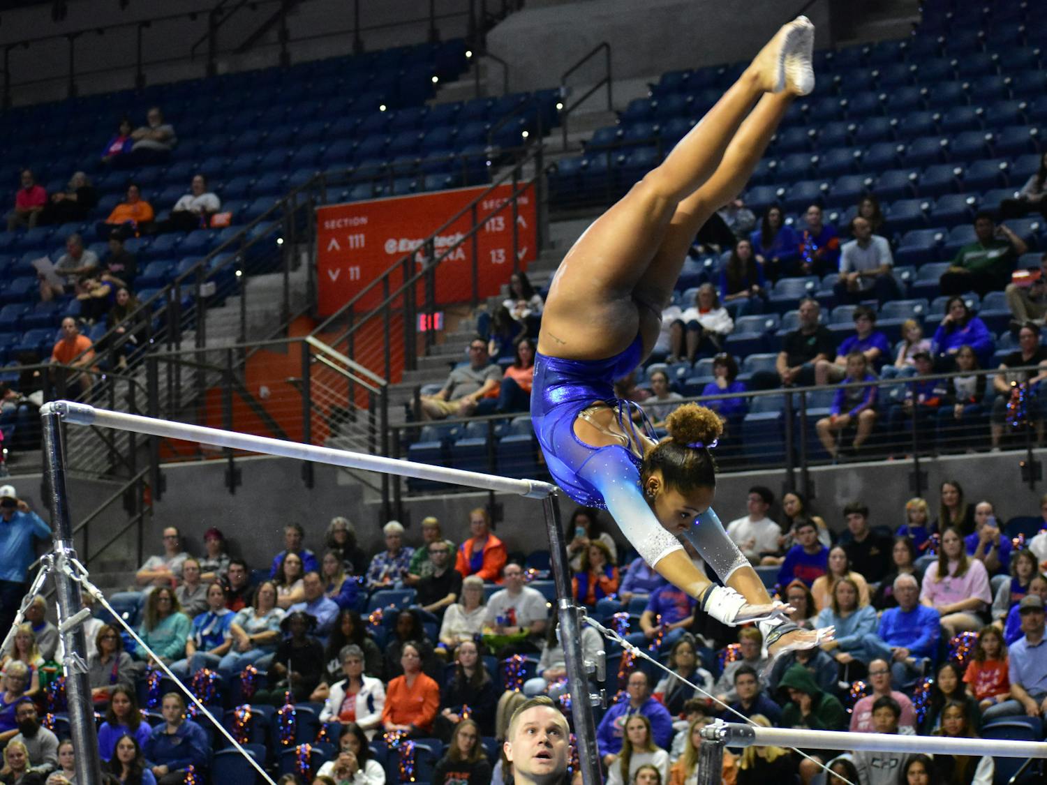 Junior Sloane Blakely performs on the uneven bars in the Gators gymnastics' Hype Night on Monday, Dec. 4, 2023.
