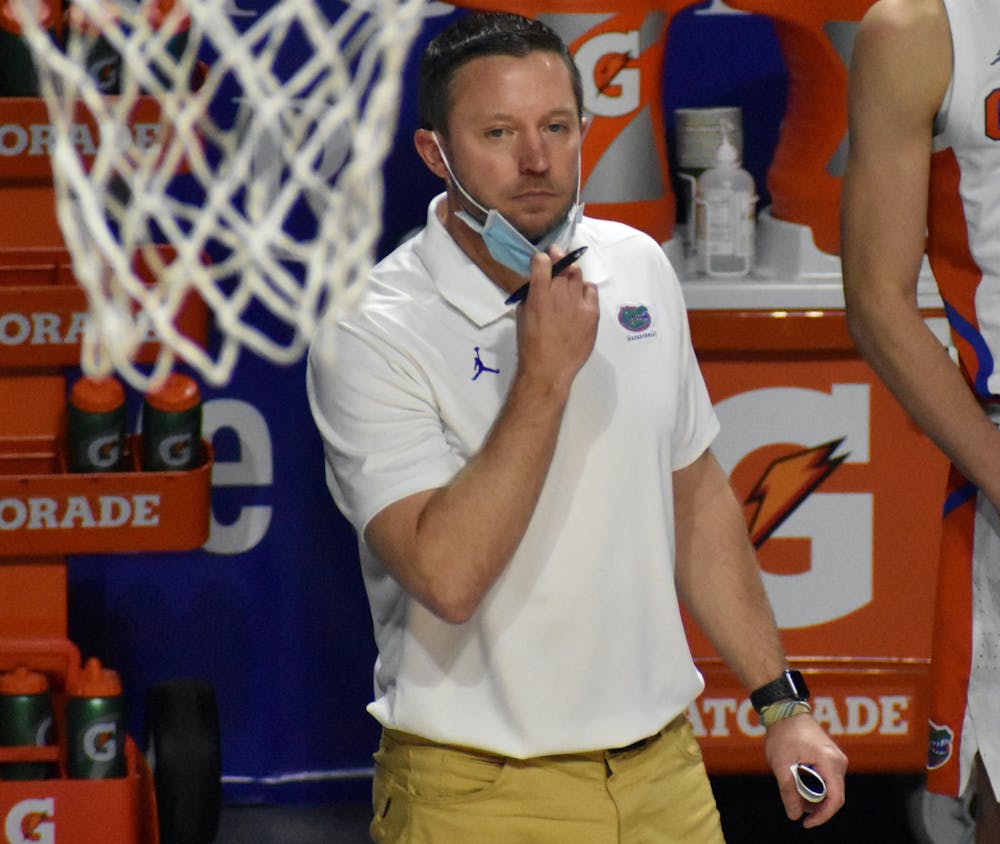 Coach Mike White stands on the sidelines at the O’Connell Center against Georgia Feb. 20. White and the Gators lost against Oral Roberts 81-78 in the second round of the NCAA Tournament Sunday. 
