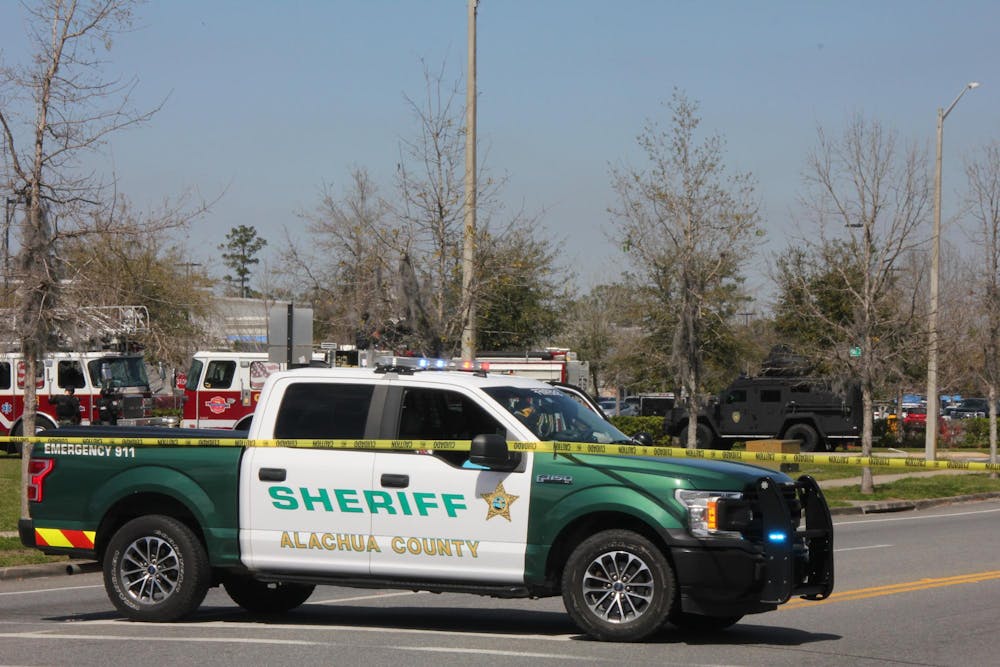 Local law enforcement arrested a woman who fired shots in the Butler Plaza Walmart parking lot Saturday after an hours-long standoff.