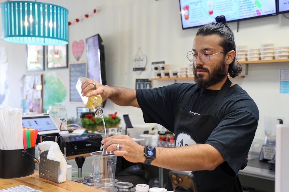 <p>Up2U Nutrition owner, Nicolas "Nico" Echavarria makes a drink, Wednesday, Sept. 2, 2026, in Gainesville, Fla.</p>