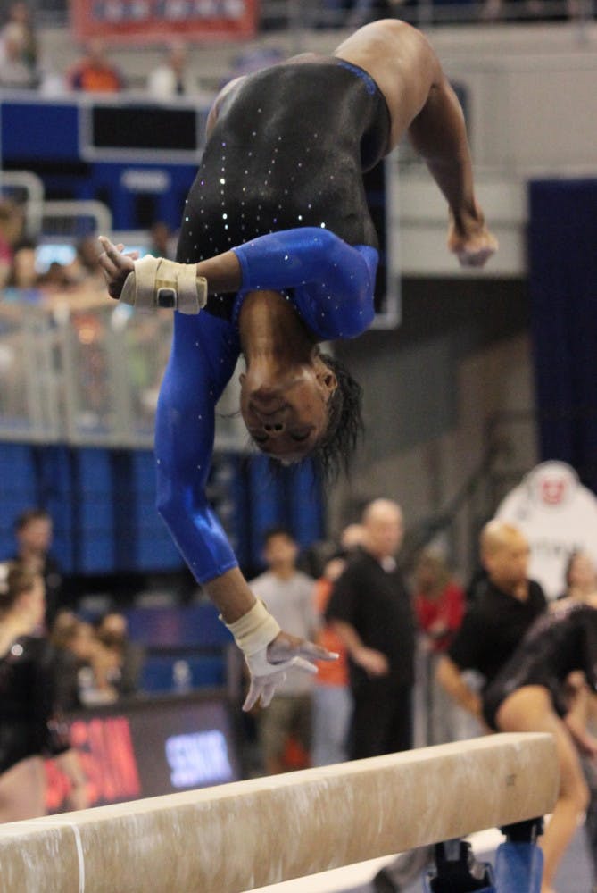 Junior Ashanée Dickerson spots her landing during a beam routine. She is looking to be more consistent as UF heads to NCAA Regionals.