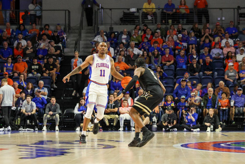 <p>Guard Kyle Lofton dribbles the ball against the Vanderbilt Commodores in an 88-80 defeat Saturday, Feb. 11, 2023. </p>