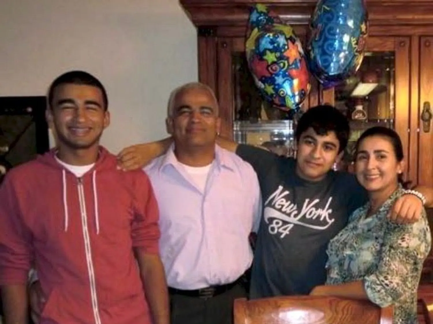 Christian Aguilar, Carlos Aguilar, Alex Aguilar and Claudia Aguilar pose for a photo on Alex's 15th birthday.
