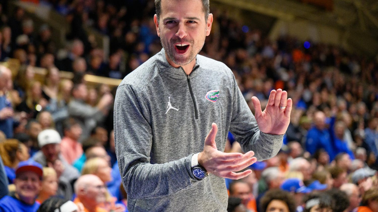 Florida head coach Todd Golden claps and smiles before an NCAA college basketball game against Duke, Tuesday, Dec. 2, 2025, at Cameron Indoor Stadium in Durham, NC.