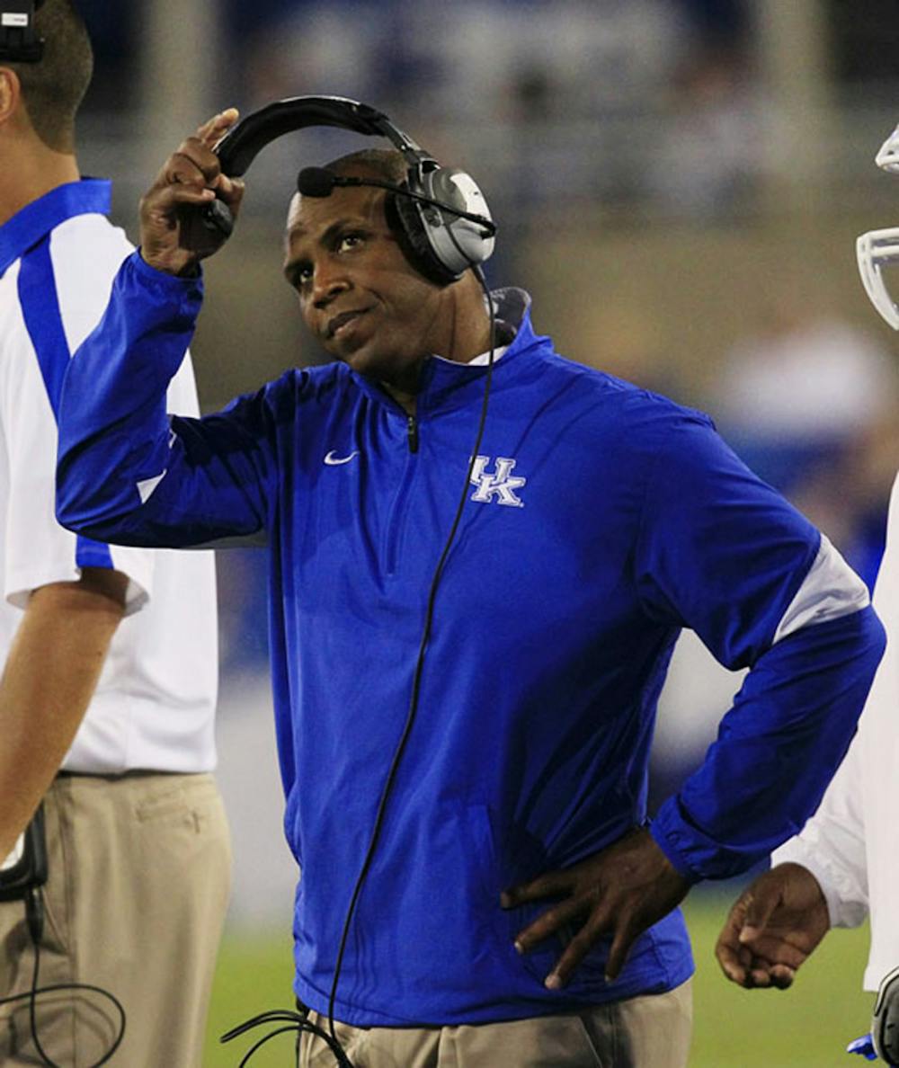 <p>Joker Phillips watches the scoreboard during a Kentucky game on Sept. 17, 2011, in Lexington, Ky. Phillips is starting his first season at UF.</p>