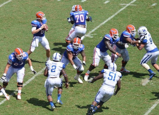 Sophomore quarterback Jeff Driskel (6) drops back to pass as his offensive line withstands the rush against the Kentucky Wildcats on Saturday at Ben Hill Griffin Stadium. Despite injuries, the Florida offensive line has progressed in pass and run blocking since playing Texas A&amp;M in the conference opener on Sept. 8.