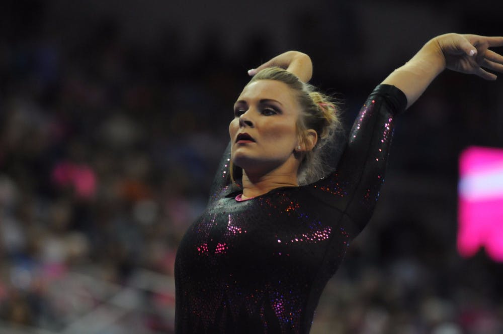 <p>Bridget Sloan performs on the balance beam during Florida's win against Arkansas on Feb. 12, 2016, in the O'Connell Center.</p>
