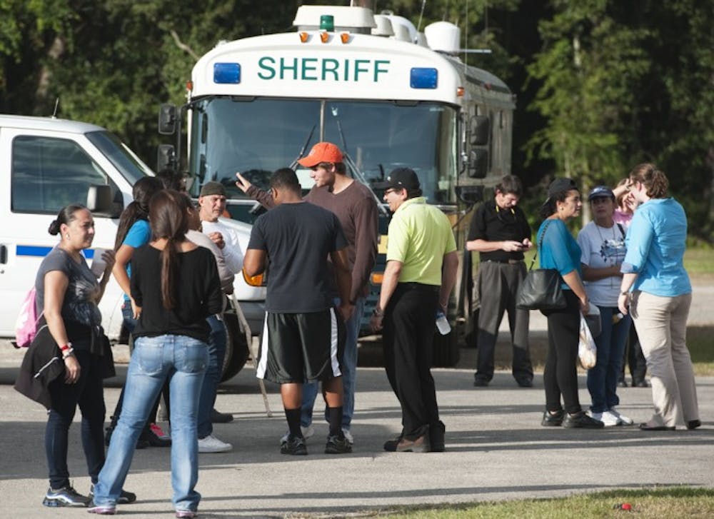 <p>Volunteers and officers continued the search for Christian Aguilar, 18, in the woods around the Alachua County Fairgrounds on Wednesday during a press conference.</p>