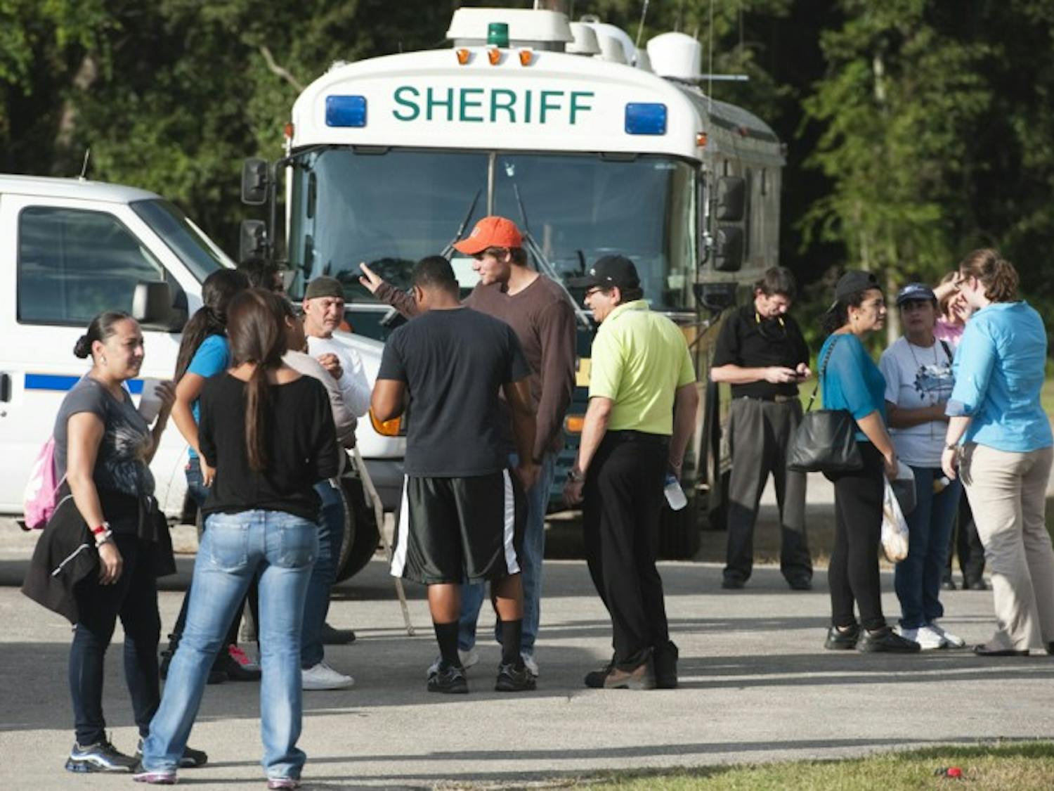 Volunteers and officers continued the search for Christian Aguilar, 18, in the woods around the Alachua County Fairgrounds on Wednesday during a press conference.
