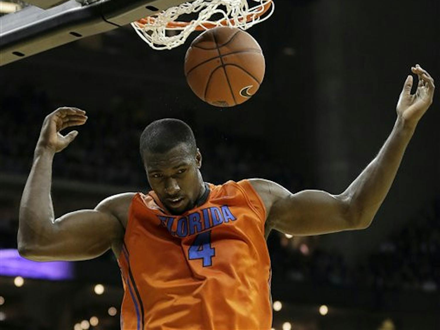 Florida center Patric Young (4) dunks the ball during the second half against Kansas State on Saturday at the Sprint Center in Kansas City, Mo. Kansas State won the game 67-61.&nbsp;