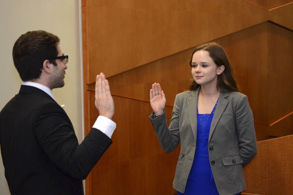 <p>Former Senate President Pro-Tempore Jenny Clements is sworn in as Senate President by UF Student Body Chief Justice Andy Schein in the Reitz Union Senate Chamber on Feb. 23, 2016.</p>